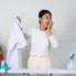 The-young-maid-who-is-stinking-the-smell-of-the-finished-shirt-on-the-white